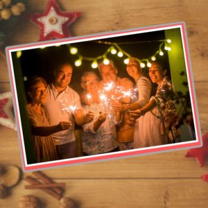 Photo of hispanic mexican latinx family with lit sparklers in their hands, smiling for happy new year A.R.M. action resource management