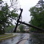 Photograph of downed power lines in a residential neighborhood in rainy weather for A.R.M. action resource management safety tips