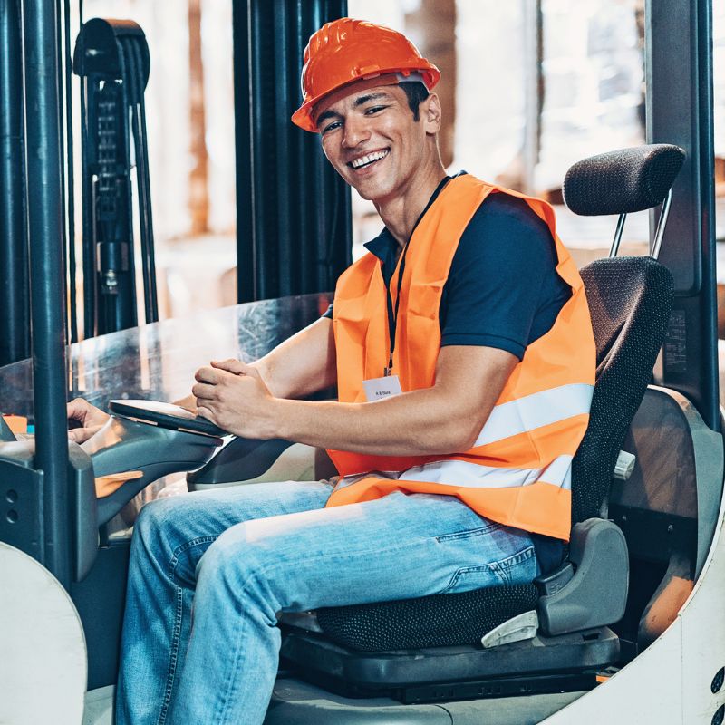 Image of smiling forklift operator clothing safety short sleeves warehouse A.R.M. action resource management