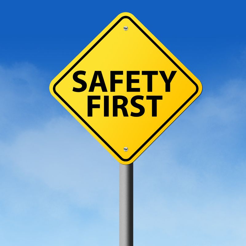 Image of bright yellow sign "SAFETY FIRST" against a blue sky OSHA A.R.M. action resource management