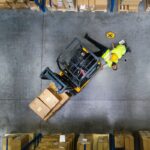 Aerial view of warehouse worker injured on floor after being hit by a forklift for safety tips for warehouse workers A.R.M. action resource management