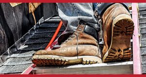 Close-up image of dirty, well-worn work boots of worker on ladder for Safety on your feet A.R.M. action resource management