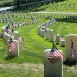 Image of Arlington National Cemetery with American flags on headstones