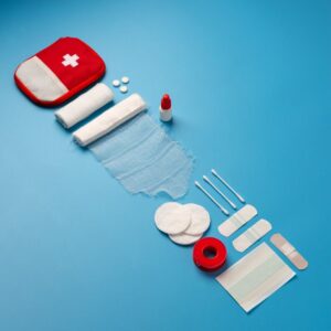 Image of First Aid Kit spread out on blue background A.R.M. action resource management