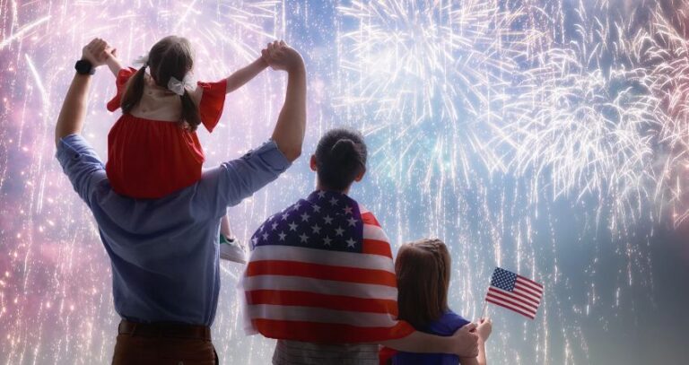Image of patriotic family of 4 from behind at 4th of July fireworks safety A.R.M. action resource management