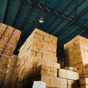 Image of boxes towering in warehouse A.R.M. action resource management