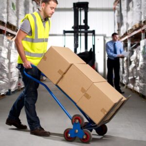 Image of warehouse worker transporting stack of boxes. A.R.M. Action Resource Management