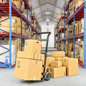 Image of hand cart holding and surrounded by boxes in a warehouse. A.R.M. Action Resource Management