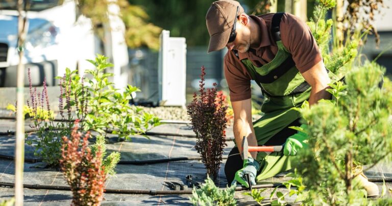 An image of a professional gardener installing an irrigation system. Outdoor Safety Tips
