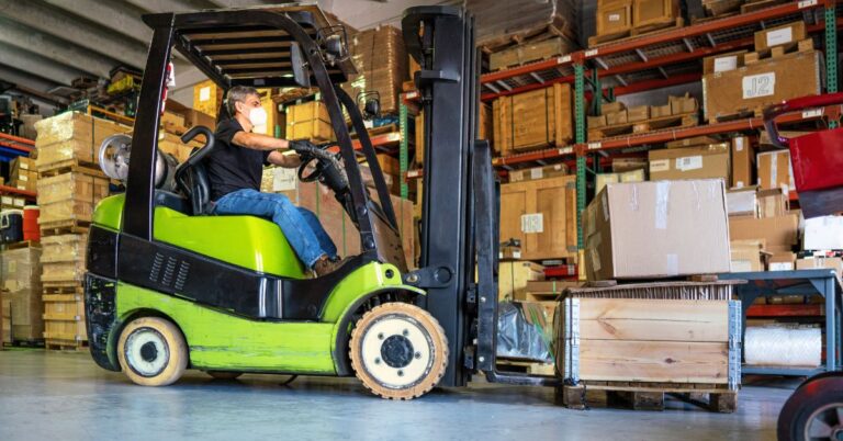 Importance of Forklift safety. An image of a forklift operator moving warehouse material.