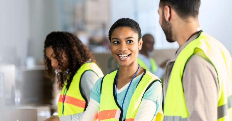 This is an image of four warehouse workers, one of them smiling. August 17, 2024 Blog General Safety Tips for Warehouse Workers.