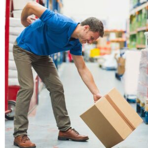 Warehouse worker experiencing back pain due to poor lifting techniques