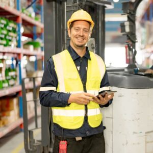 A happy warehouse worker. Workplace Fall Prevention: Warehouse Safety Essentials