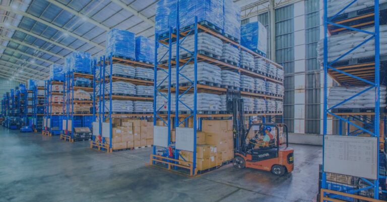 A forklift operator at work in the warehouse. Beat the Heat: Summer Safety Tips for Warehouse Workers