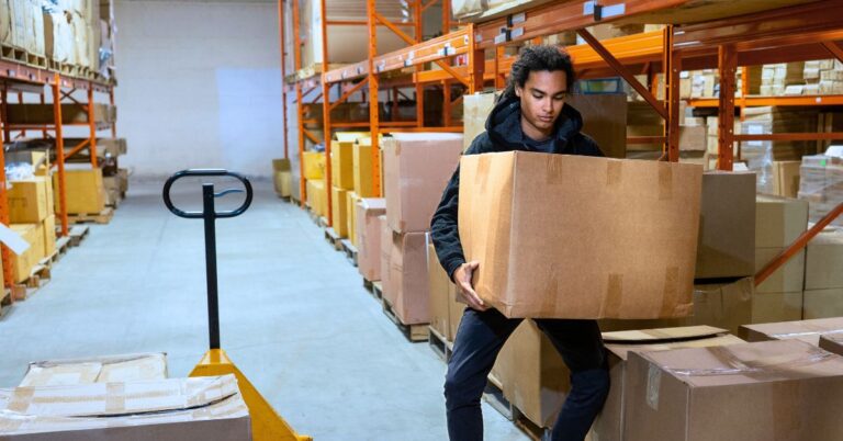 A warehouse worker moving a box. Lift Smart, Work Safe: Proper Techniques to Prevent Injuries