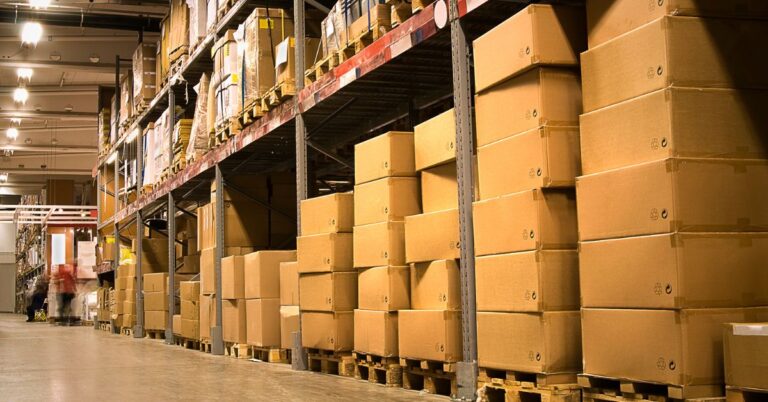 An image of boxes on warehouse shelves. Stay Sharp: Prevent Workplace Complacency