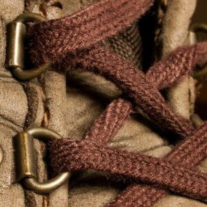 Close-up of work boot laces. Safe Footwear for Warehouse Workers