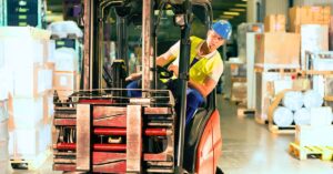 Forklift operator in warehouse. Power Up Safely: Best Practices for Using Power Tools in Warehouses